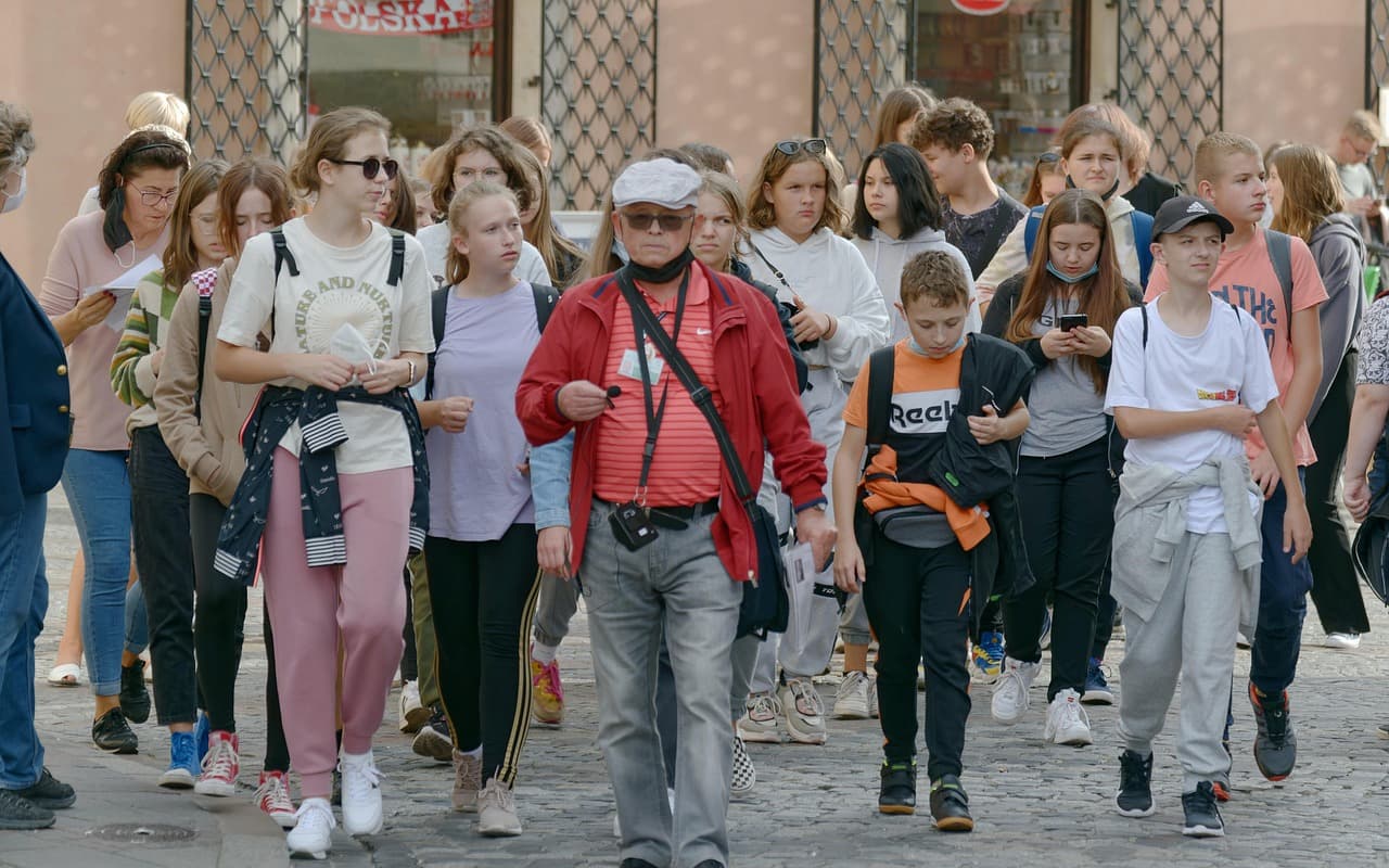 Tour guide leading a group in a European city